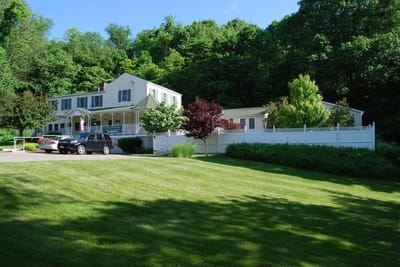 Exterior view of a senior care facility surrounded by greenery