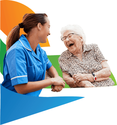 Caregiver laughing with an elderly resident