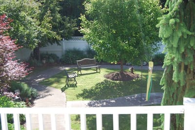 A serene garden space with benches and greenery