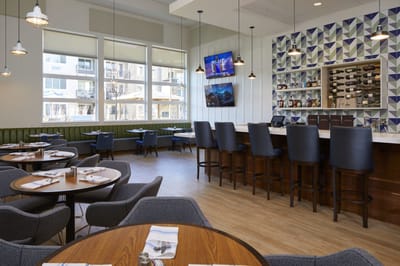 Modern dining room with tables and bar seating