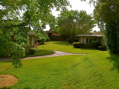 Well-maintained gardens and outdoor pathways