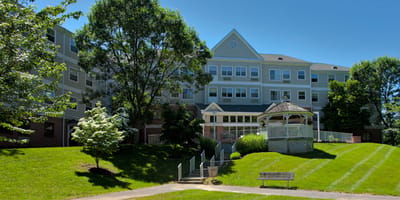 Exterior view of Pin Oak Village with landscaped grounds