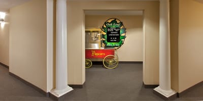 Interior hallway with a vintage popcorn cart.