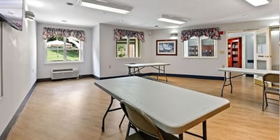 Interior of a multi-purpose room with tables and chairs