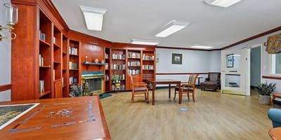Bright common area with bookshelves and seating