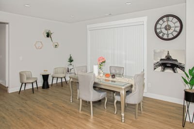 Modern common area with a dining table and decor