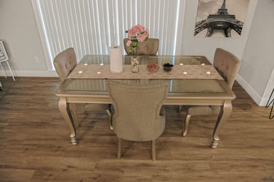 Dining table set with flowers and decorations.
