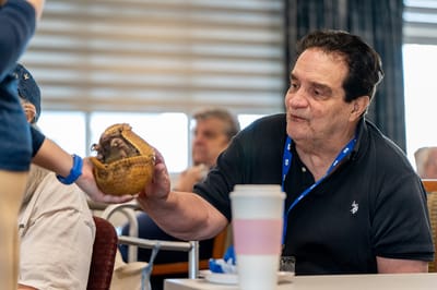 Resident engaging in activity with personal item
