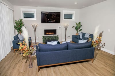 Cozy lounge area with modern furniture and decor.