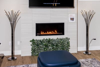 Cozy interior with a modern fireplace feature.