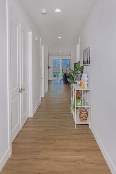 Bright corridor with decor and natural light.