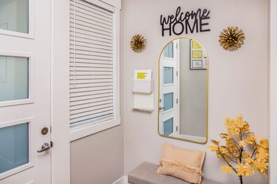 Welcoming entry with home decor and mirror