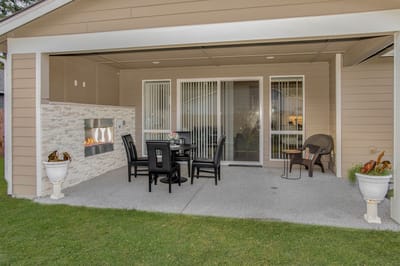 Patio seating area with a fireplace