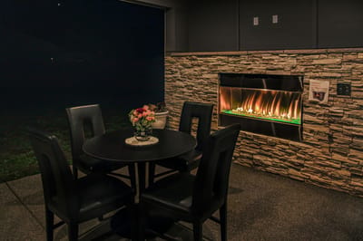 Cozy indoor seating area with fireplace.