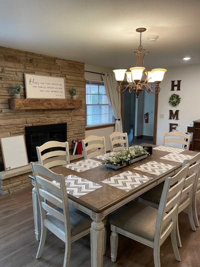 Cozy dining area with a large wooden table.