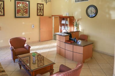 Lobby area with reception desk and seating.
