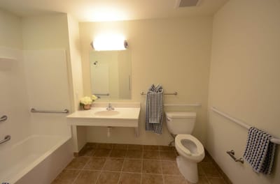 Clean bathroom with accessible features.
