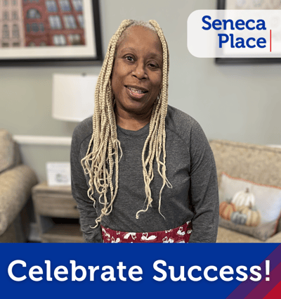 A resident celebrating in a common area.