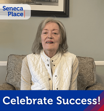 Resident celebrating success in common area.