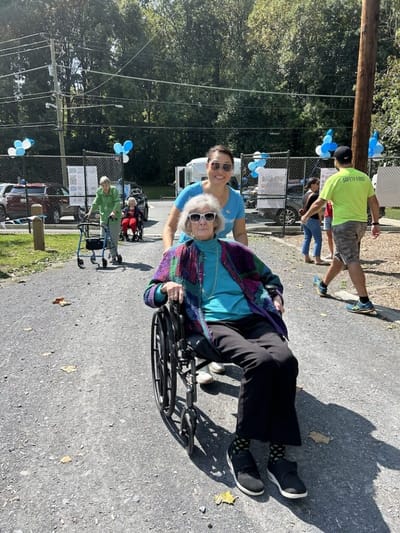 Residents and staff enjoying an outdoor event.