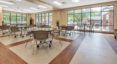 Spacious dining room with tables and chairs