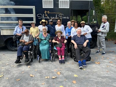 Residents and staff enjoying an outdoor activity.