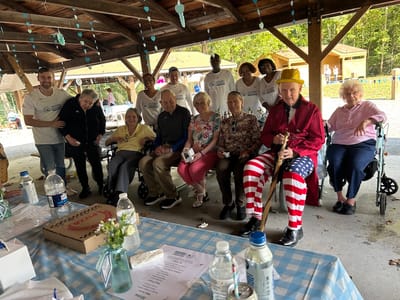 Residents and staff enjoying an outdoor event.