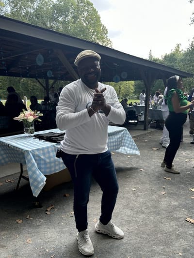 Person enjoying an outdoor event at the facility.