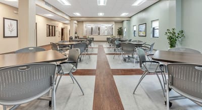 Interior view of a dining area with tables and chairs