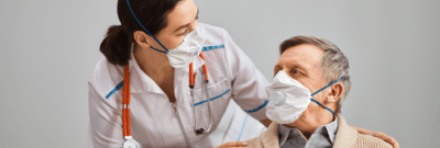 Healthcare worker interacting with a senior resident