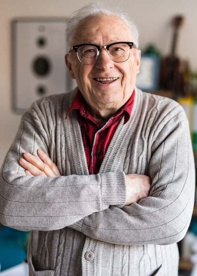 Smiling senior man in a cozy indoor setting
