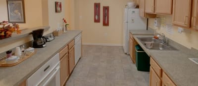 Bright and spacious kitchen area with appliances.
