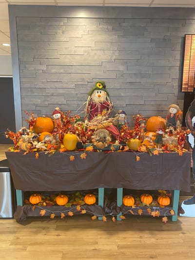 Fall-themed decoration with pumpkins and scarecrows