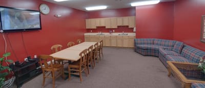 Common area with seating and kitchen space.