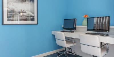 Interior office space with computers and decor.