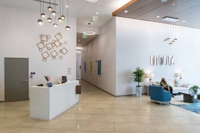 Bright interior lobby with seating and artwork