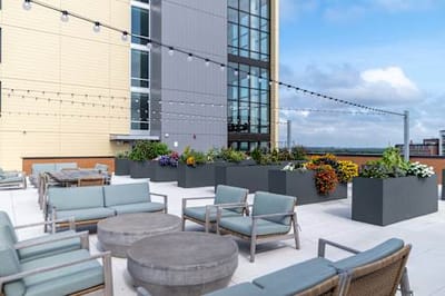 Outdoor seating area with plants and flowers