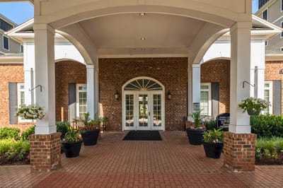 Entrance with potted plants and a welcoming door