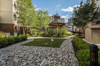 Scenic outdoor area with gazebo and greenery
