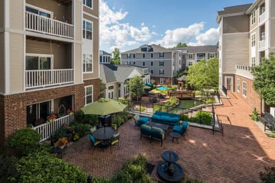Outdoor courtyard with seating and greenery