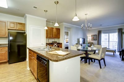 Spacious kitchen and dining area in a senior living apartment.