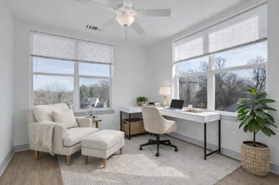 Bright and airy room with desk and chair.