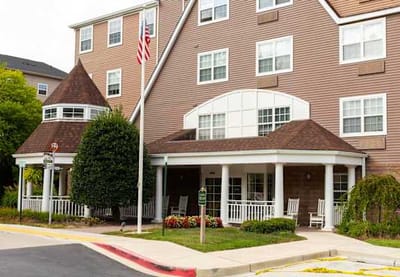 Exterior view of assisted living facility with porch