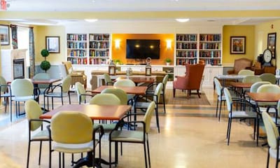 Dining area with tables and bookshelves