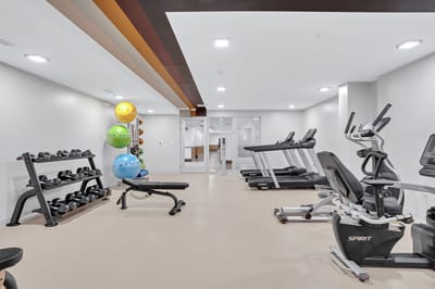 Interior view of a fitness room with equipment.