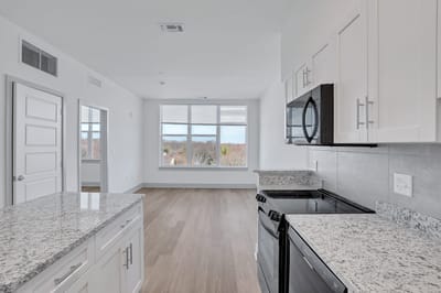 Modern kitchen and living area with large window