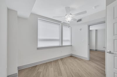 Bright and airy room with a ceiling fan.
