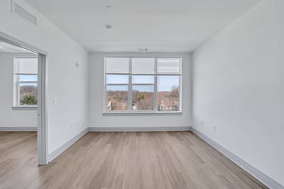 Empty room with large windows and view