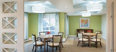 Bright common area with tables and chairs