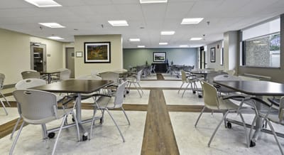 Interior view of the dining area with tables and chairs.